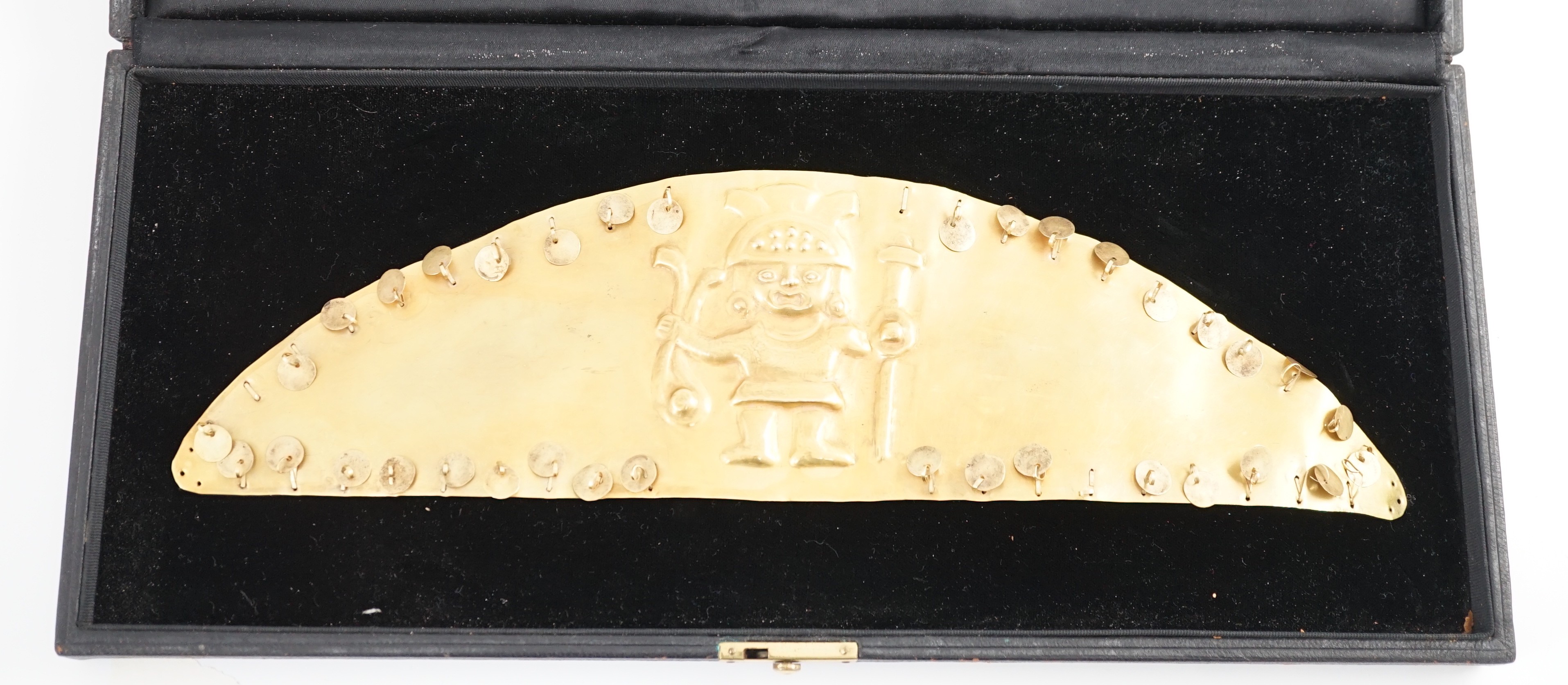 A rare pre-Columbian sheet gold headdress or breast plate, possibly Moche culture, Northern Peru, A.D. 200 - 850, 36cm wide 9.7cm high, weight 130g